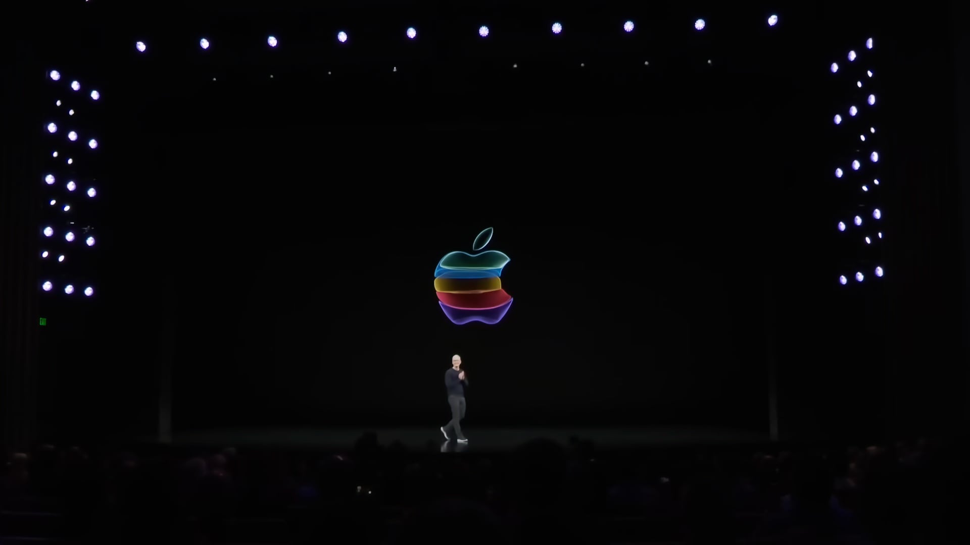 Tim Cook walking out on stage in the Steve Jobs theater